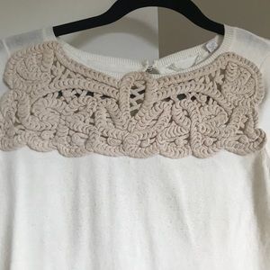 Anthropologie short sleeve knit shirt in cream.
